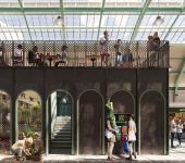 Indoor market scene with people shopping at flower stall and dining upstairs in historic building with glass roof